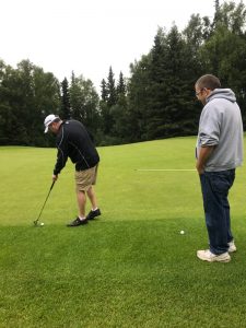 Josh and John playing golf